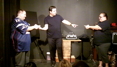Mike Paldino demonstrates a psychic connection between two spectators in Philadelphia.