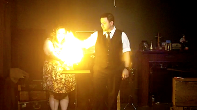 Mike Paldino produces fire for a spectator at his show in Philadelphia.
