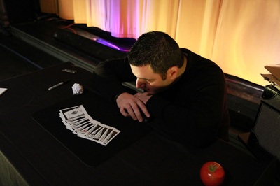 Magician Mike Paldino with Polaroids, in Boyertown, Pa.