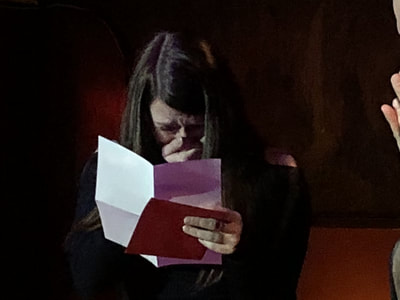 Audience member cries on stage during Mike Paldino: Modern Oracle at Ruba in Philadelphia.